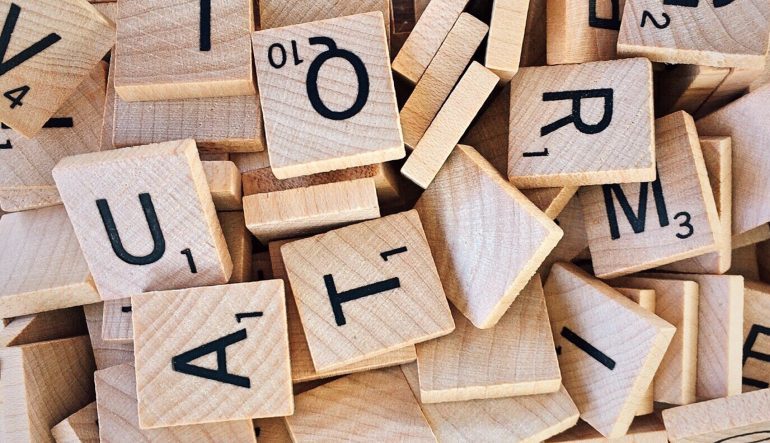pile of wooden Scrabble letters
