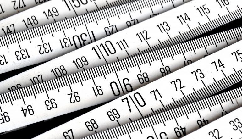 a series of black and white measuring tapes stacked on top of each other