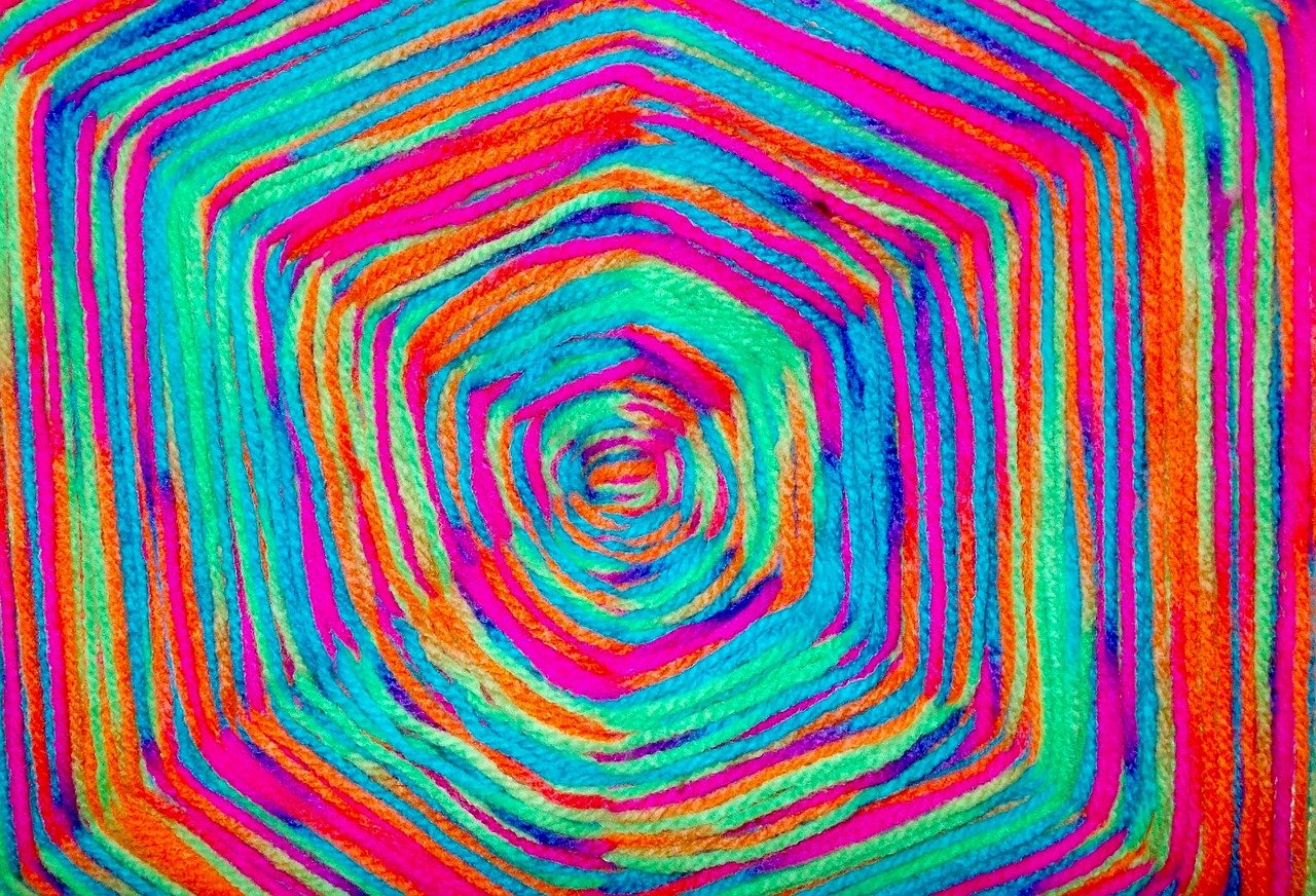Rainbow yarn in a God's eye pattern