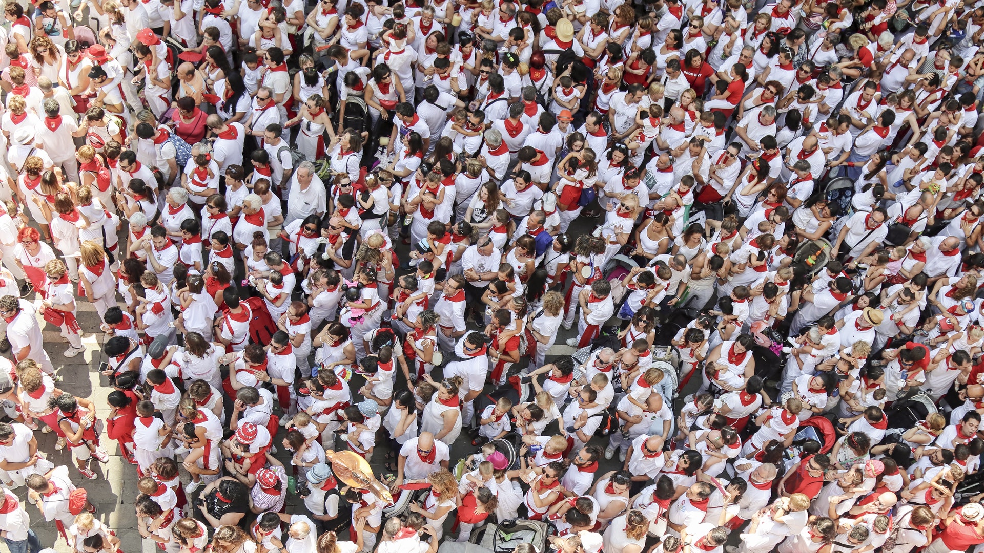 A bird's eye view of a crowd of people dressed in red and white