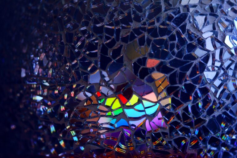 Image of glass fragments reflecting rainbow patterns