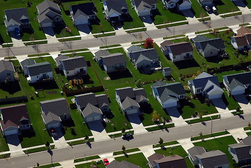 photo of rows of suburban, cookie-cutter houses, situated extremely close together