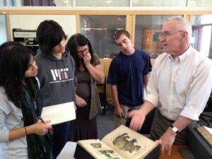 Stephen Skuce sharing a medieval bestiary with students at MIT