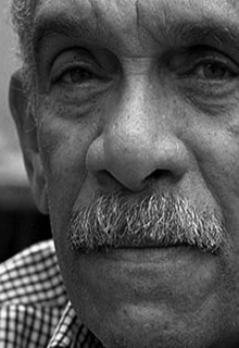 A black and white image of a Caribbean man