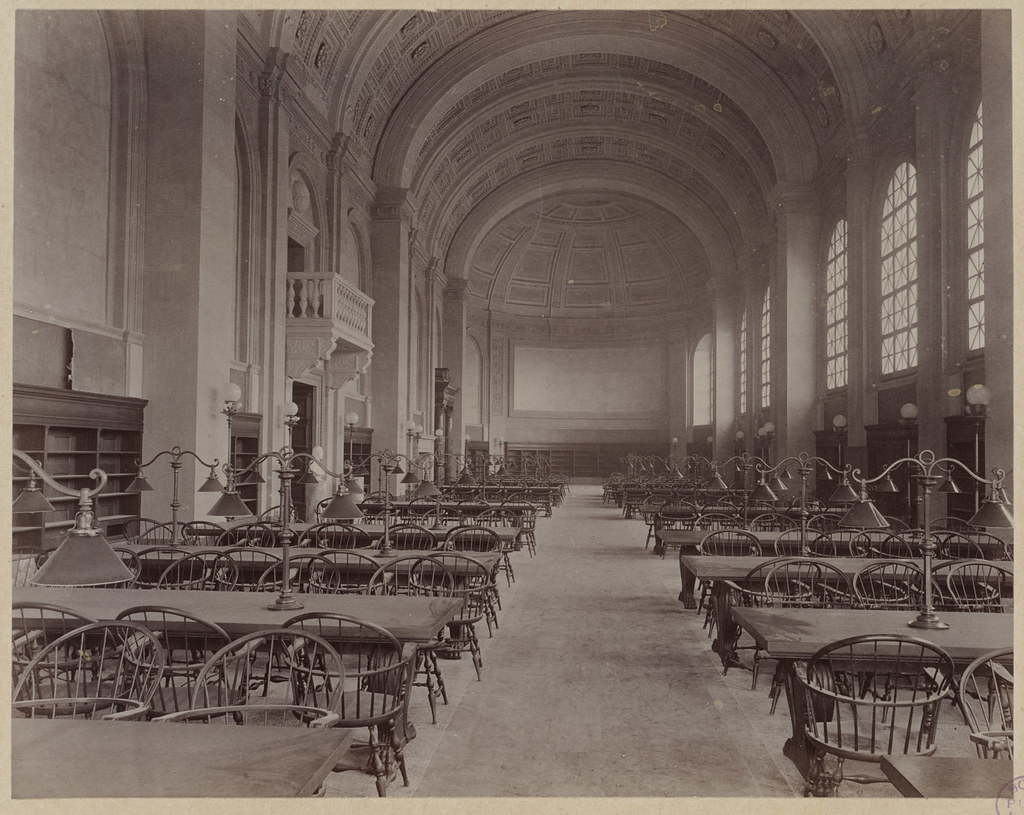 Old sepia picture of the reading room inside the Boston Public Library.