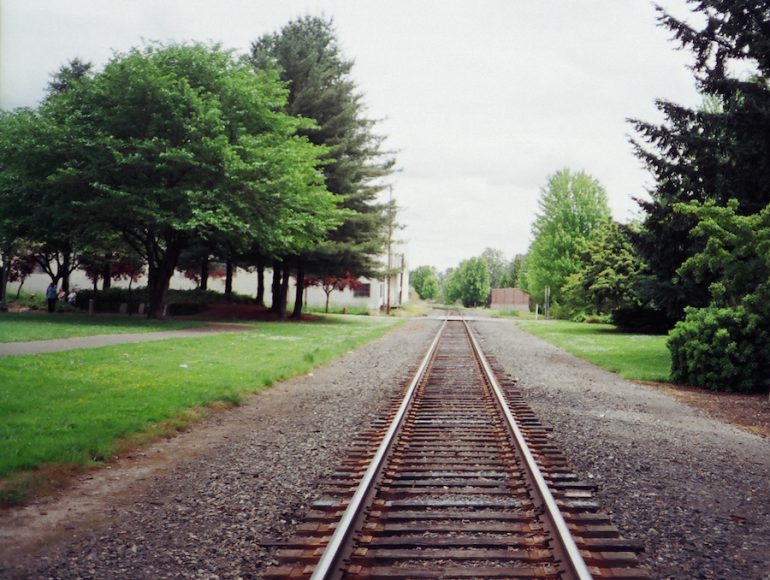 Picture of train tracks going through a town