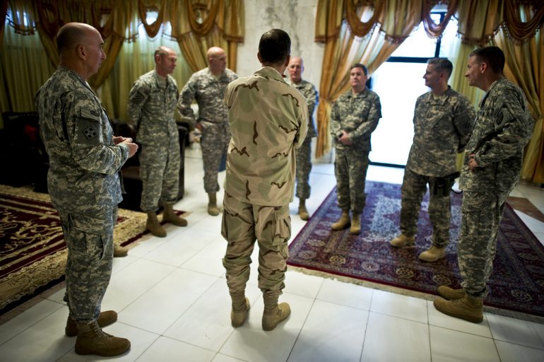 Picture of a group of soldiers standing in a circle - Image courtesy of US Army