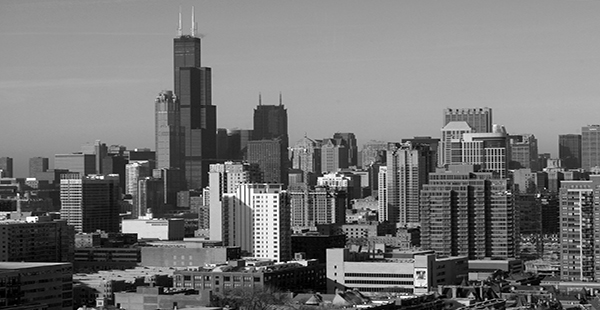 Black and white picture of a city skyline. 