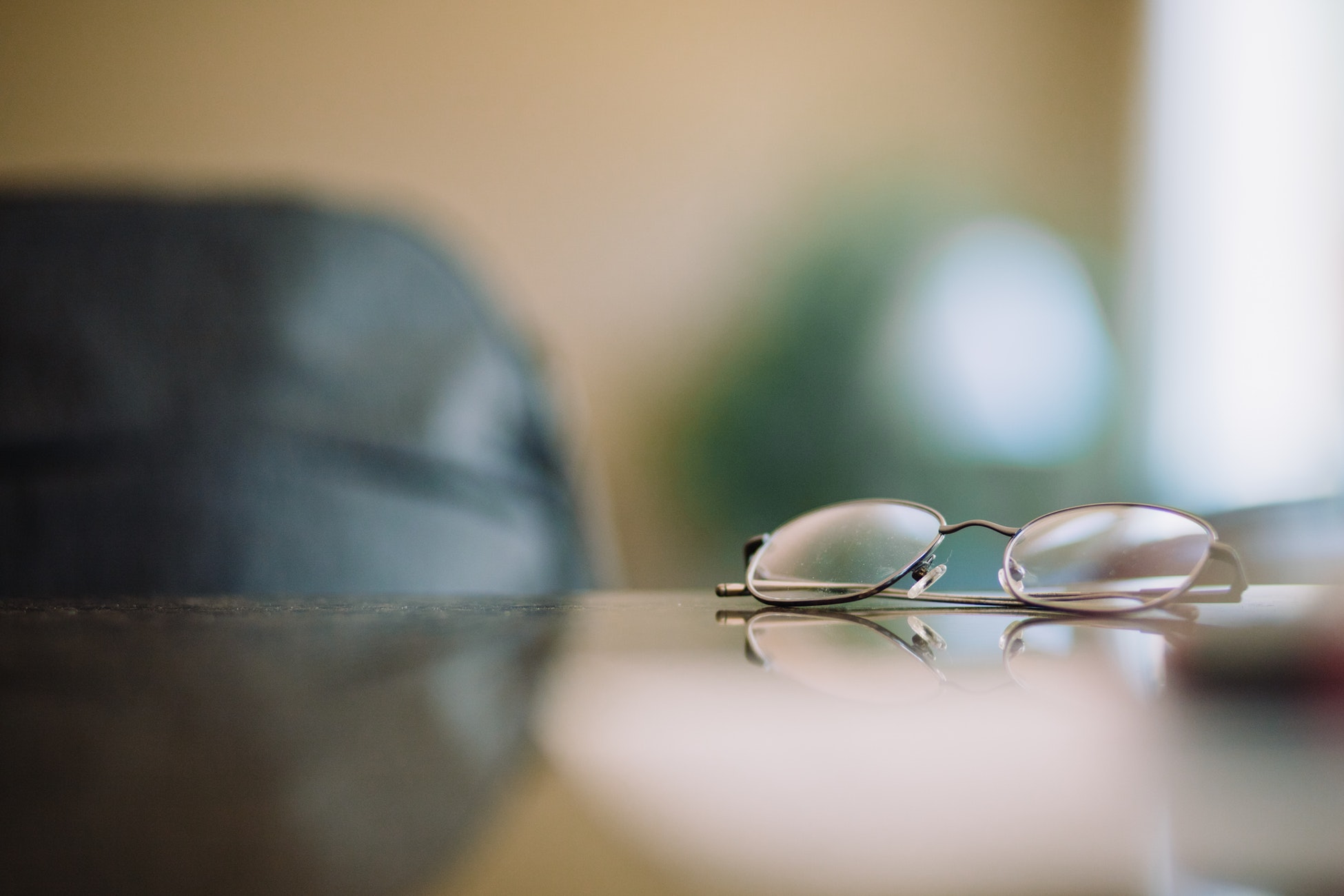 picture of gray framed eyeglasses on table