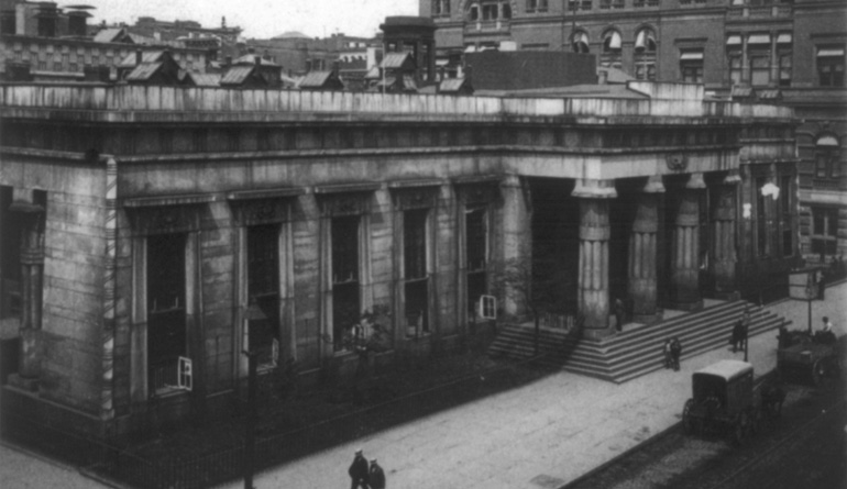 Old black and white picture of the outside of a bank