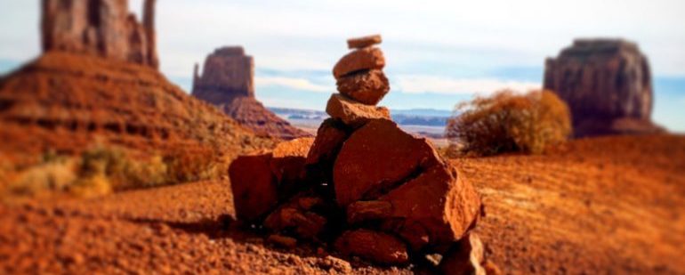 Picture of a stack of rocks in the desert. 