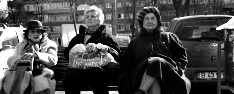 older women on a bench; black and white 