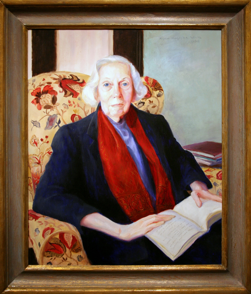 Painting of an old woman sitting in an armchair with a book.