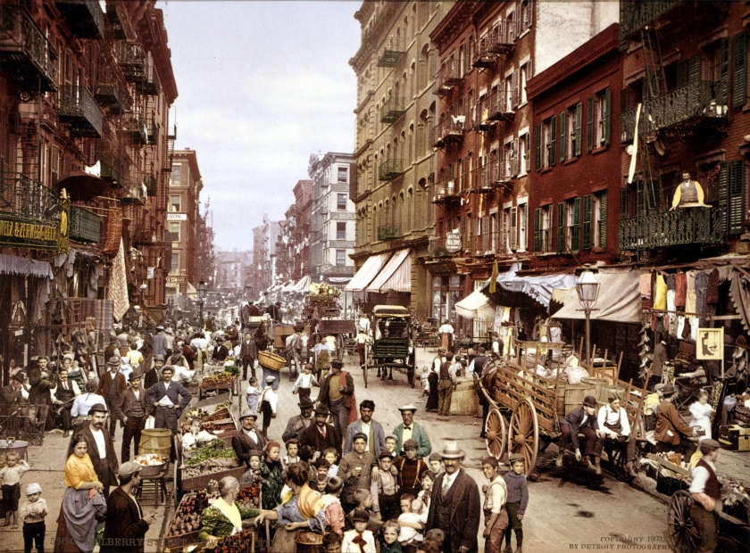 Old New York street with people at a market.