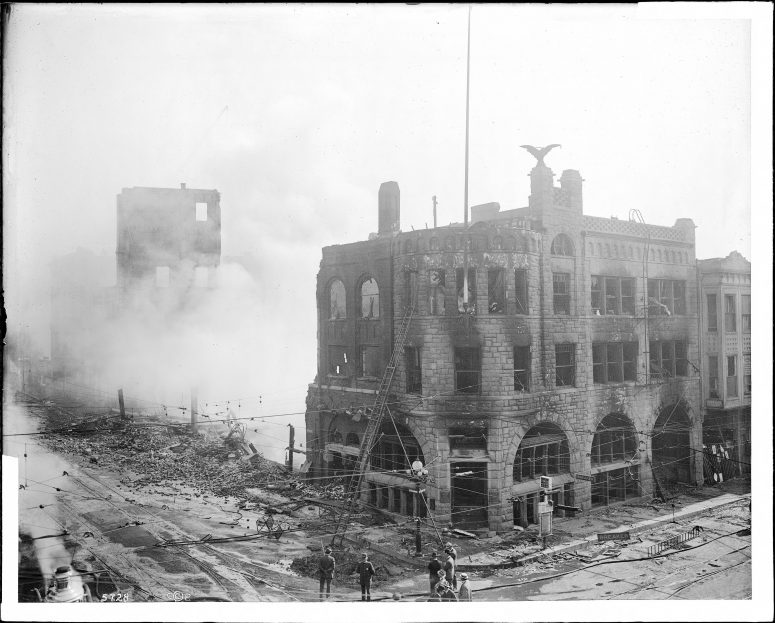 Old photo of a building burning.