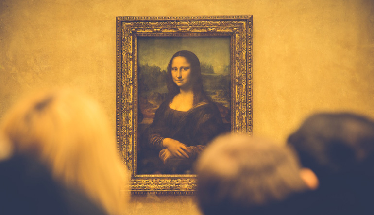 People looking at the Mona Lisa.