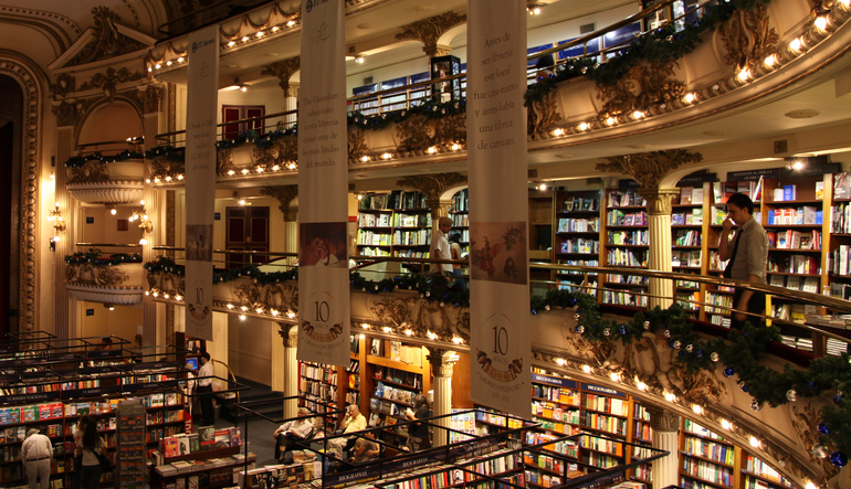 Large building with multiple floors covered in bookshelves. 