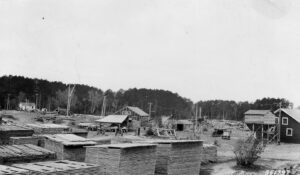 old photo of houses by water 
