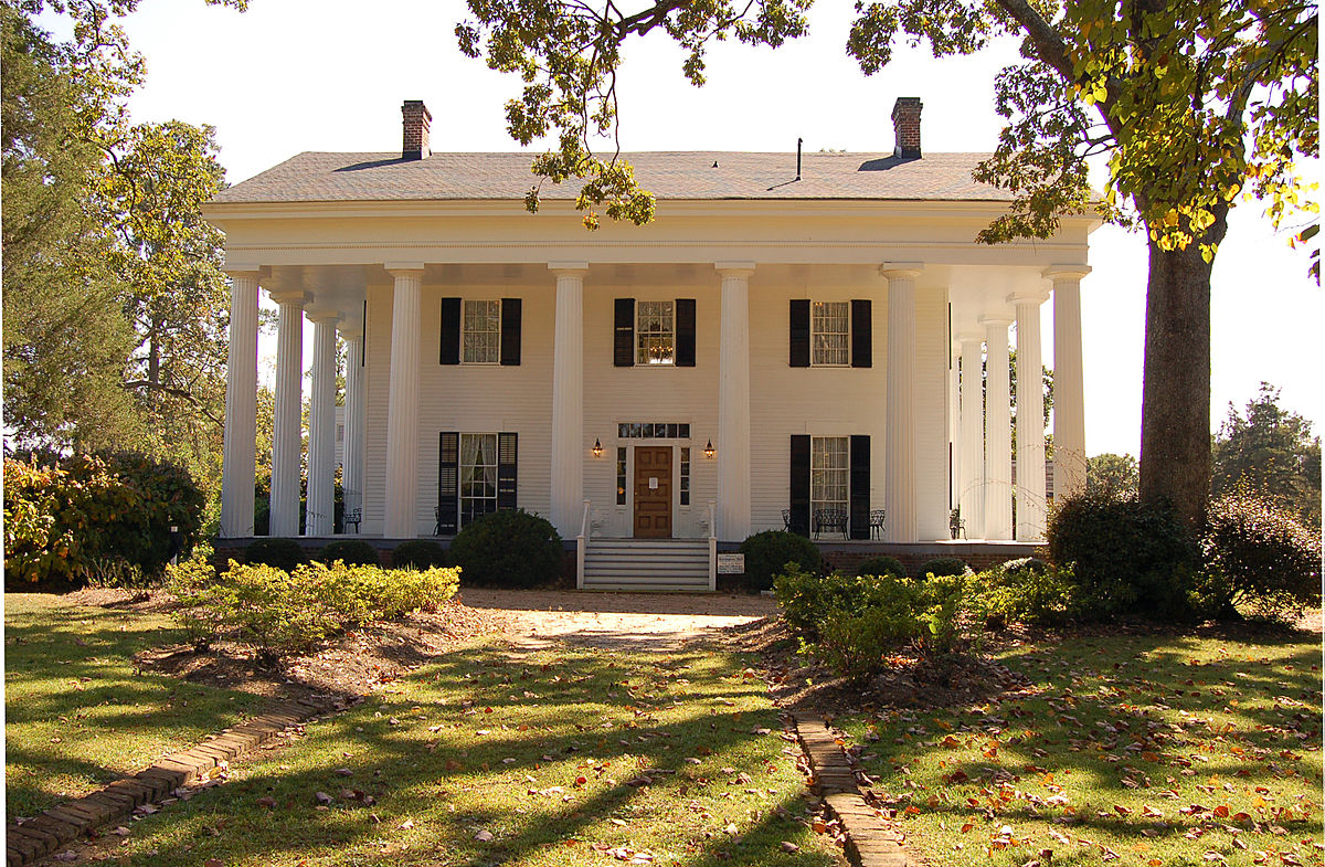 fancy house with white columns 