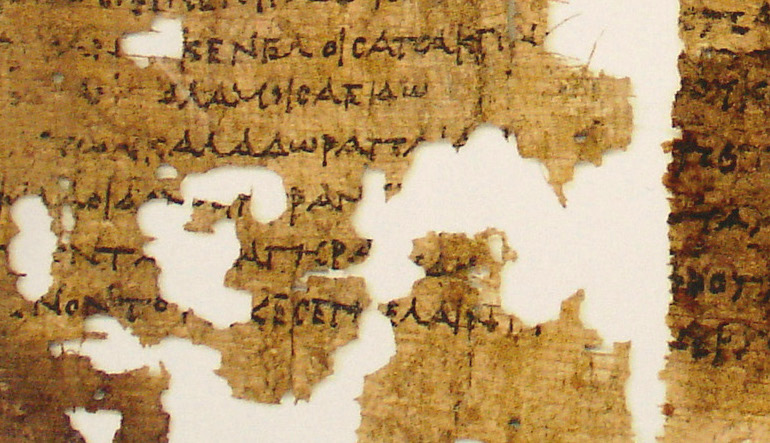 Fragmented pieces of parchment with script.