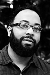 Black and white photo of author Kevin Young