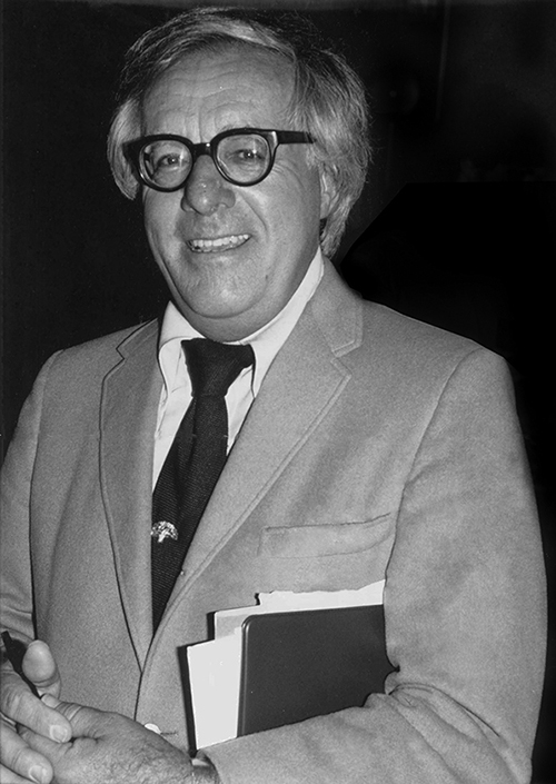 Image of Ray Bradbury holding a binder.