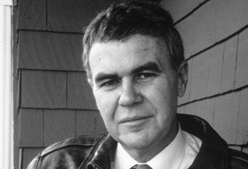 A black and white headshot of Raymond Carver on a porch.