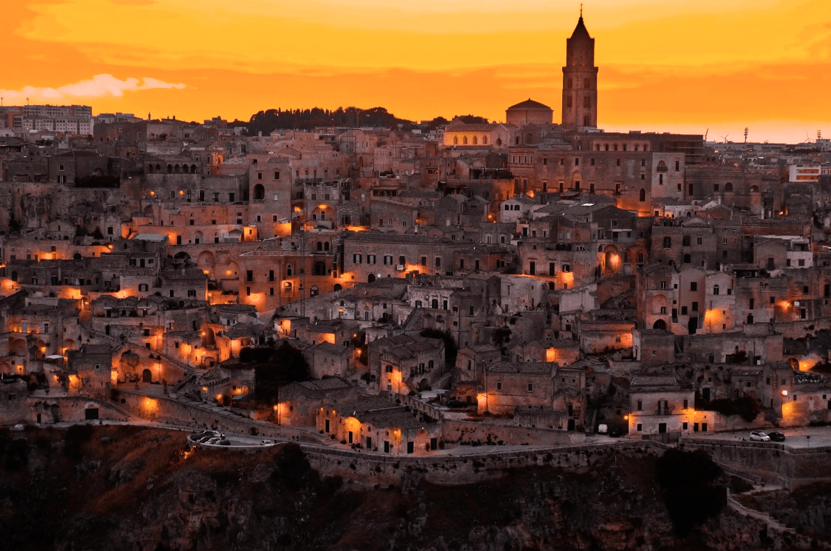 a photograph of an old Italian city at sunset