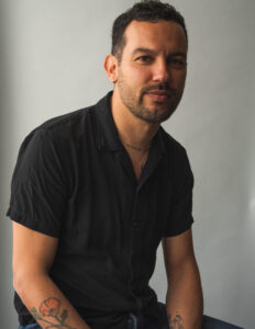 Headshot of guest editor Justin Torres in a black shirt.